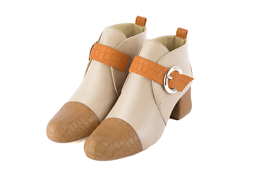 Camel beige, champagne white and marigold orange women's ankle boots with buckles at the front. Round toe. Low flare heels. Front view - Florence KOOIJMAN